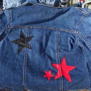 BLUE DENIM JACKET WITH STARS PAINTED ON THE BACK